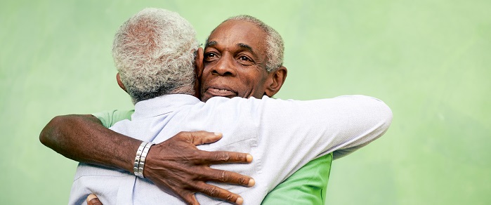 Two men hugging